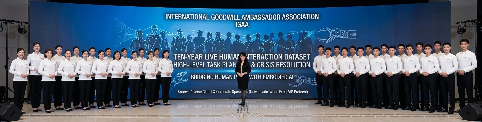 A long line of IGAA ambassadors in uniform on stage, in front of a screen reading Ten-year live human interaction dataset